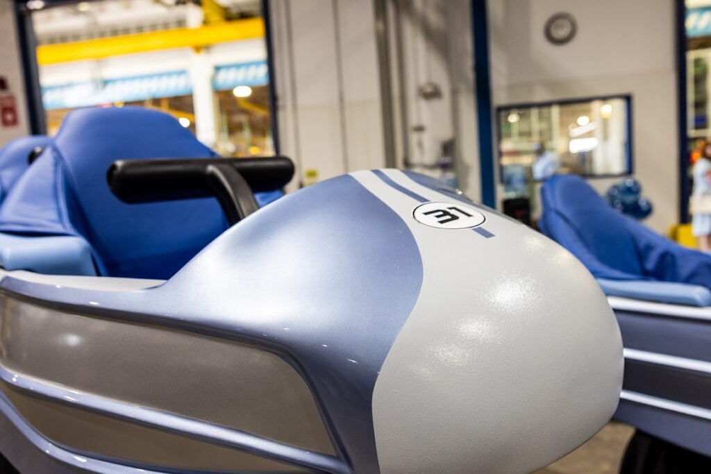 behind the scenes at disney world, space mountain vehicles are serviced at central shops